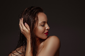 Image showing Portrait of beautiful stylish woman isolated on dark studio background