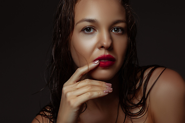 Image showing Portrait of beautiful stylish woman isolated on dark studio background