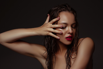 Image showing Portrait of beautiful stylish woman isolated on dark studio background