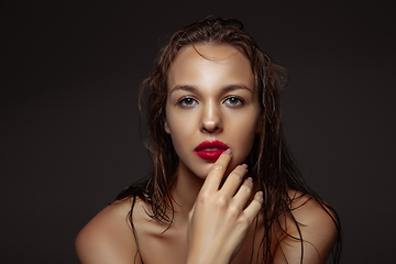 Image showing Portrait of beautiful stylish woman isolated on dark studio background