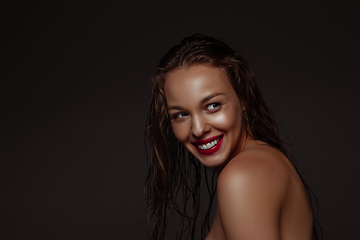 Image showing Portrait of beautiful stylish woman isolated on dark studio background