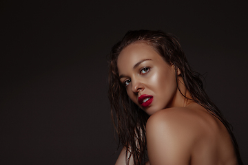 Image showing Portrait of beautiful stylish woman isolated on dark studio background