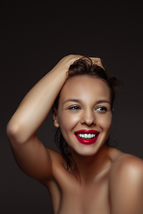 Image showing Portrait of beautiful stylish woman isolated on dark studio background