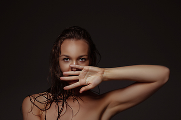 Image showing Portrait of beautiful stylish woman isolated on dark studio background