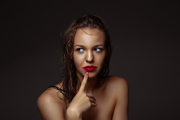 Image showing Portrait of beautiful stylish woman isolated on dark studio background