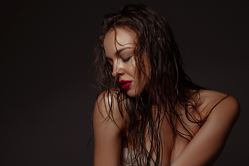 Image showing Portrait of beautiful stylish woman isolated on dark studio background