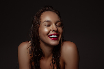 Image showing Portrait of beautiful stylish woman isolated on dark studio background