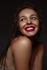 Image showing Portrait of beautiful stylish woman isolated on dark studio background