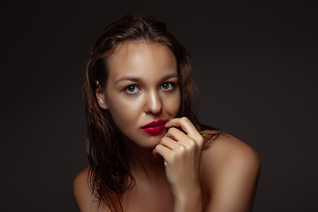 Image showing Portrait of beautiful stylish woman isolated on dark studio background