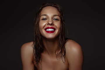 Image showing Portrait of beautiful stylish woman isolated on dark studio background