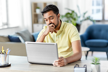 Image showing indian man with laptop working at home office