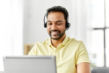 Image showing indian man with headset and laptop working at home