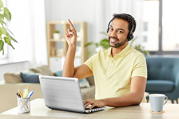 Image showing indian man with headset and laptop working at home