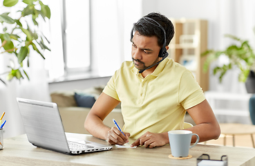 Image showing indian man with headset and laptop working at home