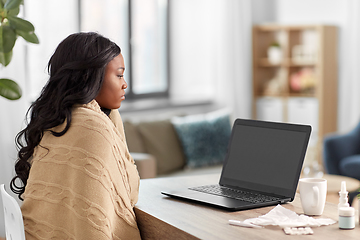 Image showing sick woman having video call on laptop at home