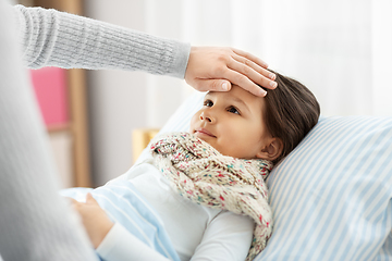 Image showing mother measuring temperature of sick daughter