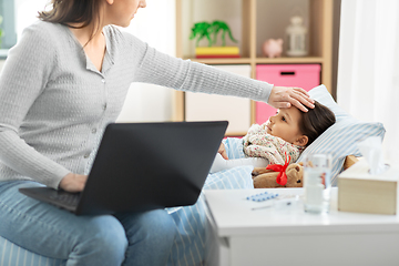 Image showing ill daughter and mother with laptop at home