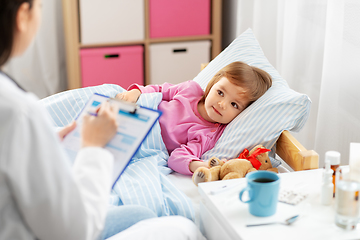 Image showing doctor with clipboard and sick girl in bed at home