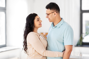 Image showing happy couple hugging at home