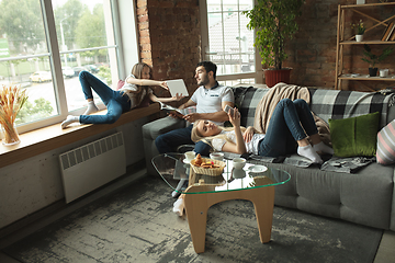 Image showing Mother, father and daughter at home having fun, comfort and cozy concept