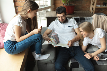 Image showing Mother, father and daughter at home having fun, comfort and cozy concept