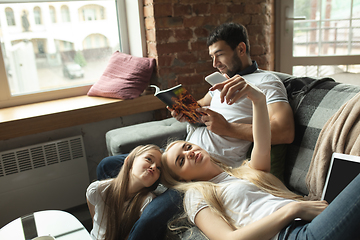 Image showing Mother, father and daughter at home having fun, comfort and cozy concept