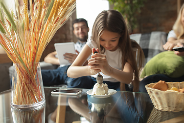 Image showing Mother, father and daughter at home having fun, comfort and cozy concept