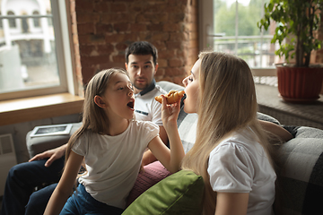 Image showing Mother, father and daughter at home having fun, comfort and cozy concept