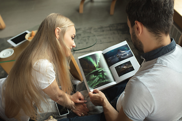 Image showing Mother, father and daughter at home having fun, comfort and cozy concept