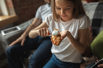 Image showing Mother, father and daughter at home having fun, comfort and cozy concept