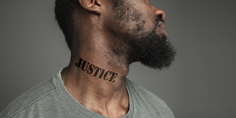 Image showing Close up portrait of a black man tired of racial discrimination has tattooed slogan on his neck