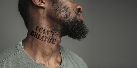 Image showing Close up portrait of a black man tired of racial discrimination has tattooed slogan on his neck