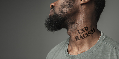 Image showing Close up portrait of a black man tired of racial discrimination has tattooed slogan on his neck