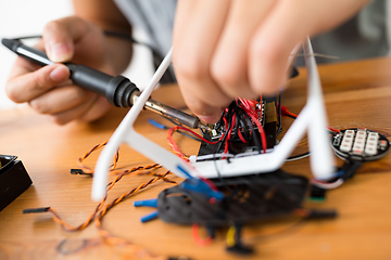 Image showing Welding the component of drone