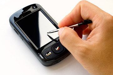 Image showing Holding pda and stylus