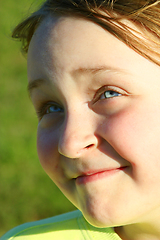 Image showing portrait of little squinting girl with nice face