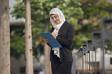 Image showing Beautiful muslim successful businesswoman portrait, confident happy CEO