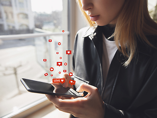 Image showing Girl connecting and sharing social media. Modern UI icons, communication, devices