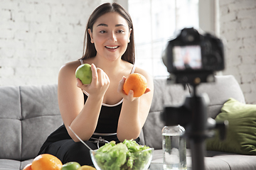 Image showing Caucasian blogger woman make vlog how to diet and lost weight. Lifestyle, influencer women, healthy concept.