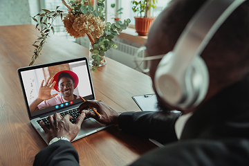 Image showing Man participate video conference looking at laptop screen during virtual meeting, videocall webcam app for business, close up