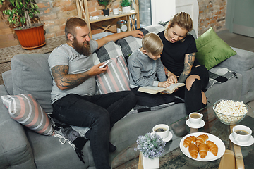 Image showing Happy family at home spending time together. Having fun, look cheerful and lovely.