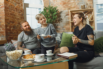 Image showing Happy family at home spending time together. Having fun, look cheerful and lovely.