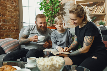 Image showing Happy family at home spending time together. Having fun, look cheerful and lovely.