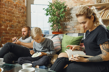 Image showing Happy family at home spending time together. Having fun, look cheerful and lovely.