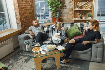 Image showing Happy family at home spending time together. Having fun, look cheerful and lovely.