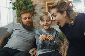 Image showing Happy family at home spending time together. Having fun, look cheerful and lovely.