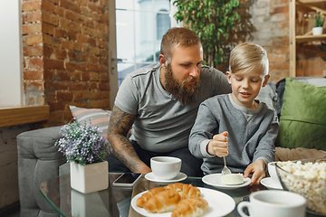 Image showing Happy family at home spending time together. Having fun, look cheerful and lovely.