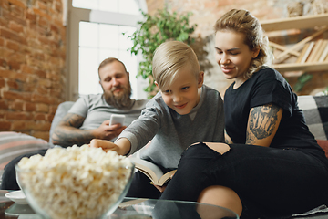 Image showing Happy family at home spending time together. Having fun, look cheerful and lovely.