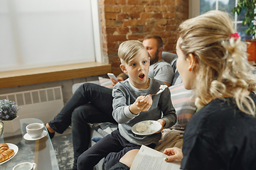 Image showing Happy family at home spending time together. Having fun, look cheerful and lovely.