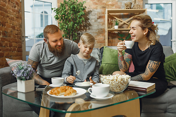 Image showing Happy family at home spending time together. Having fun, look cheerful and lovely.